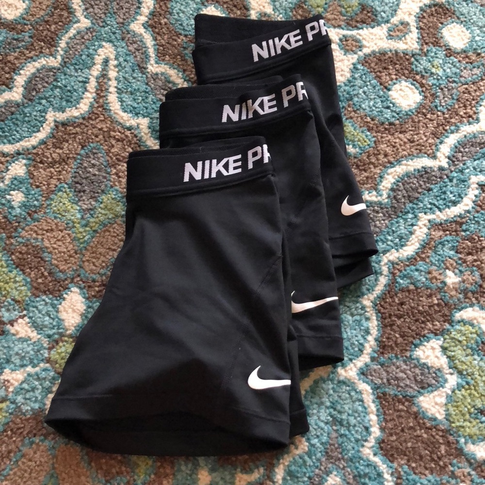Three Nike pro compression shorts